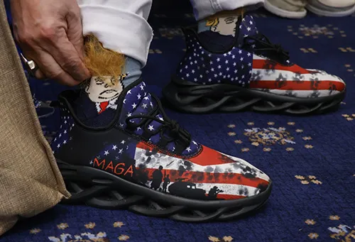 Richard Cox shows off his Trump-themed socks with orange hair at the Welcome Southern Illinois Reception at the Cannon House in Washington, D.C. on Jan. 19.