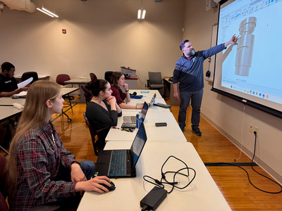 Stuemke instructing CAD students.
