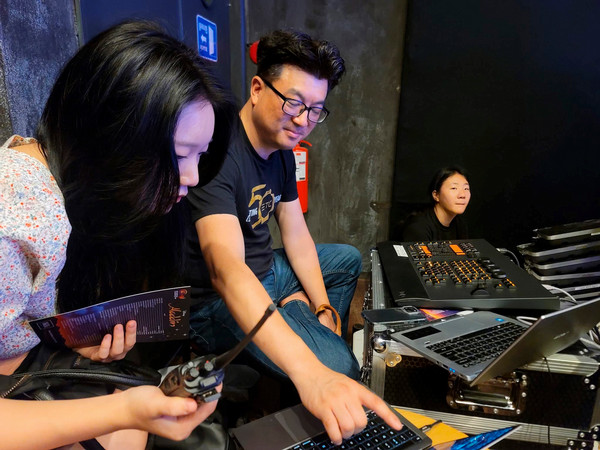 Park with students at lighting controls