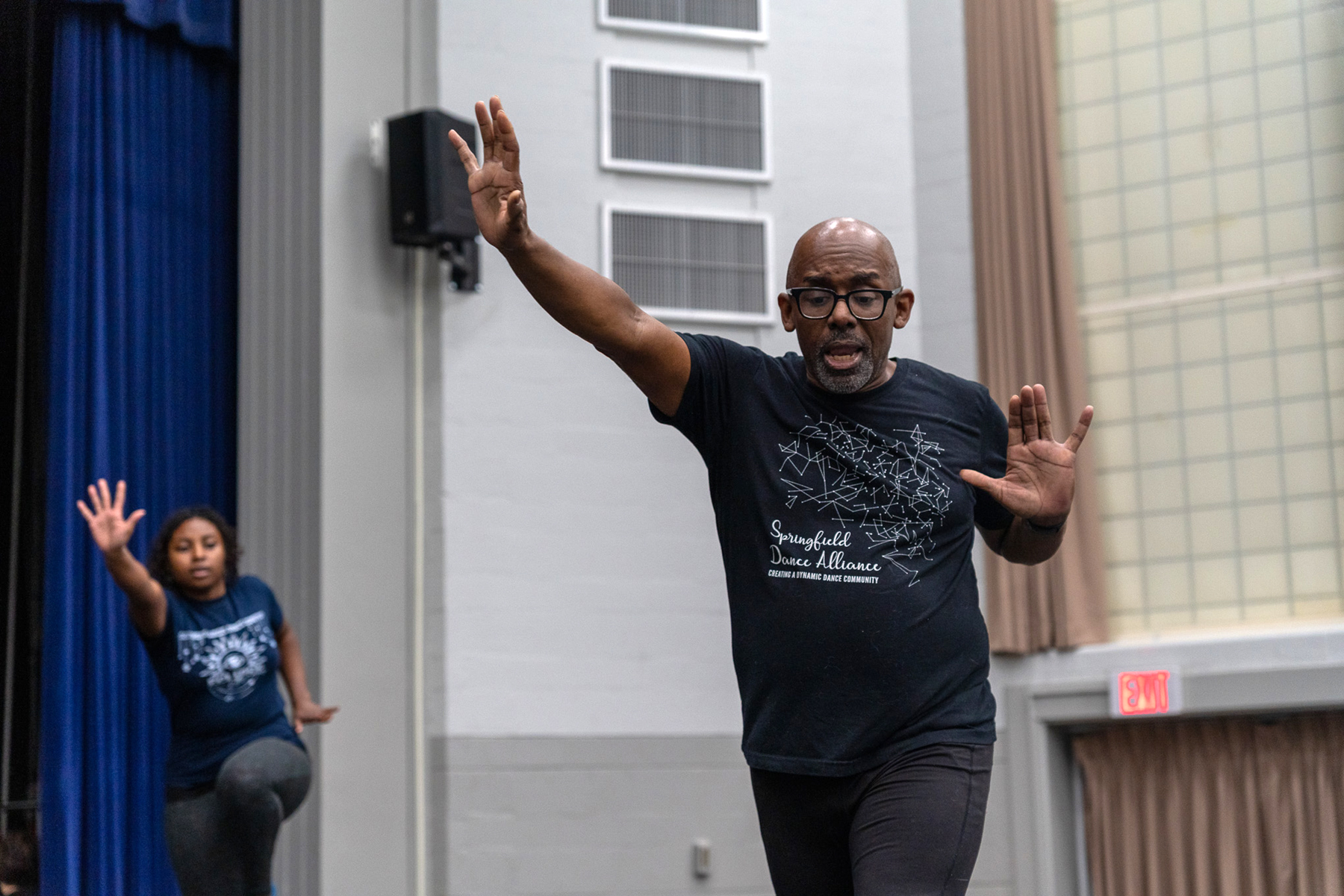 Clark running through dance moves.