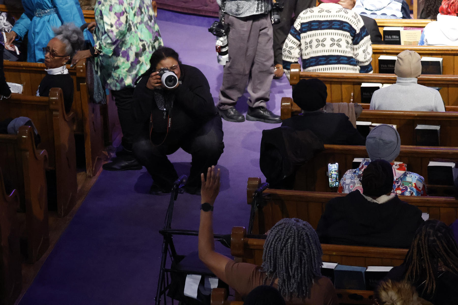 Student photographing MLK day event.