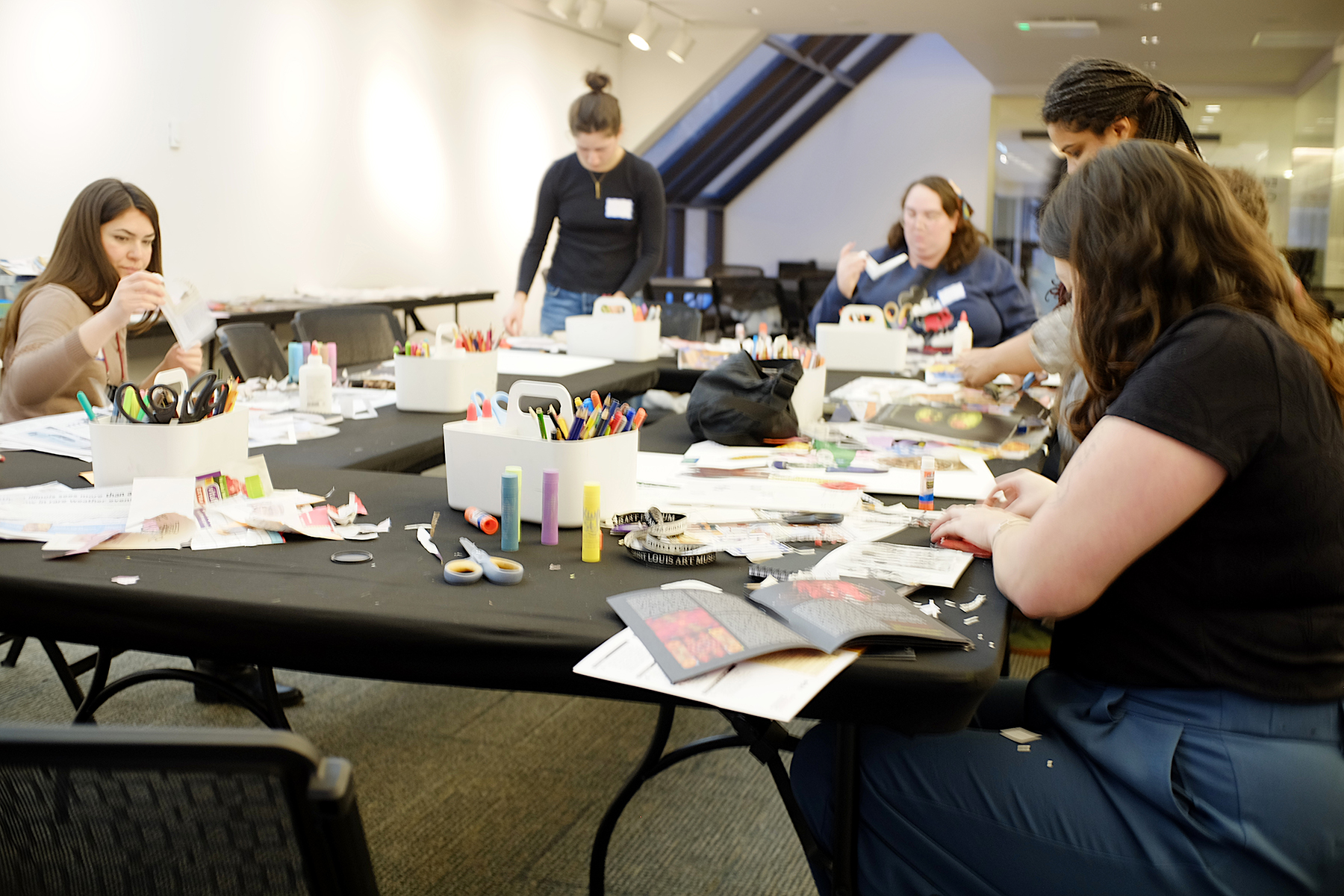 CAM art students making projects at museum.