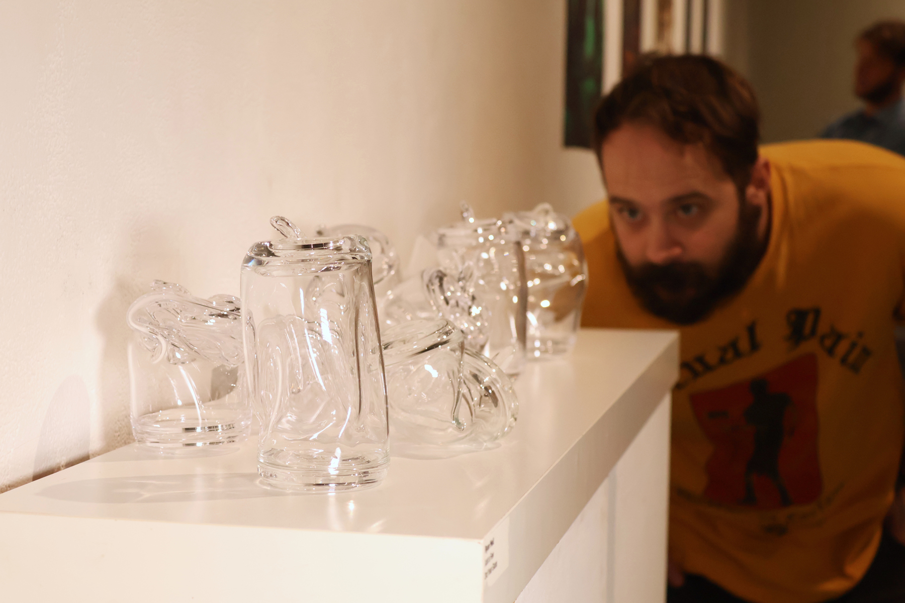 Ryan Mell eyes his artwork.