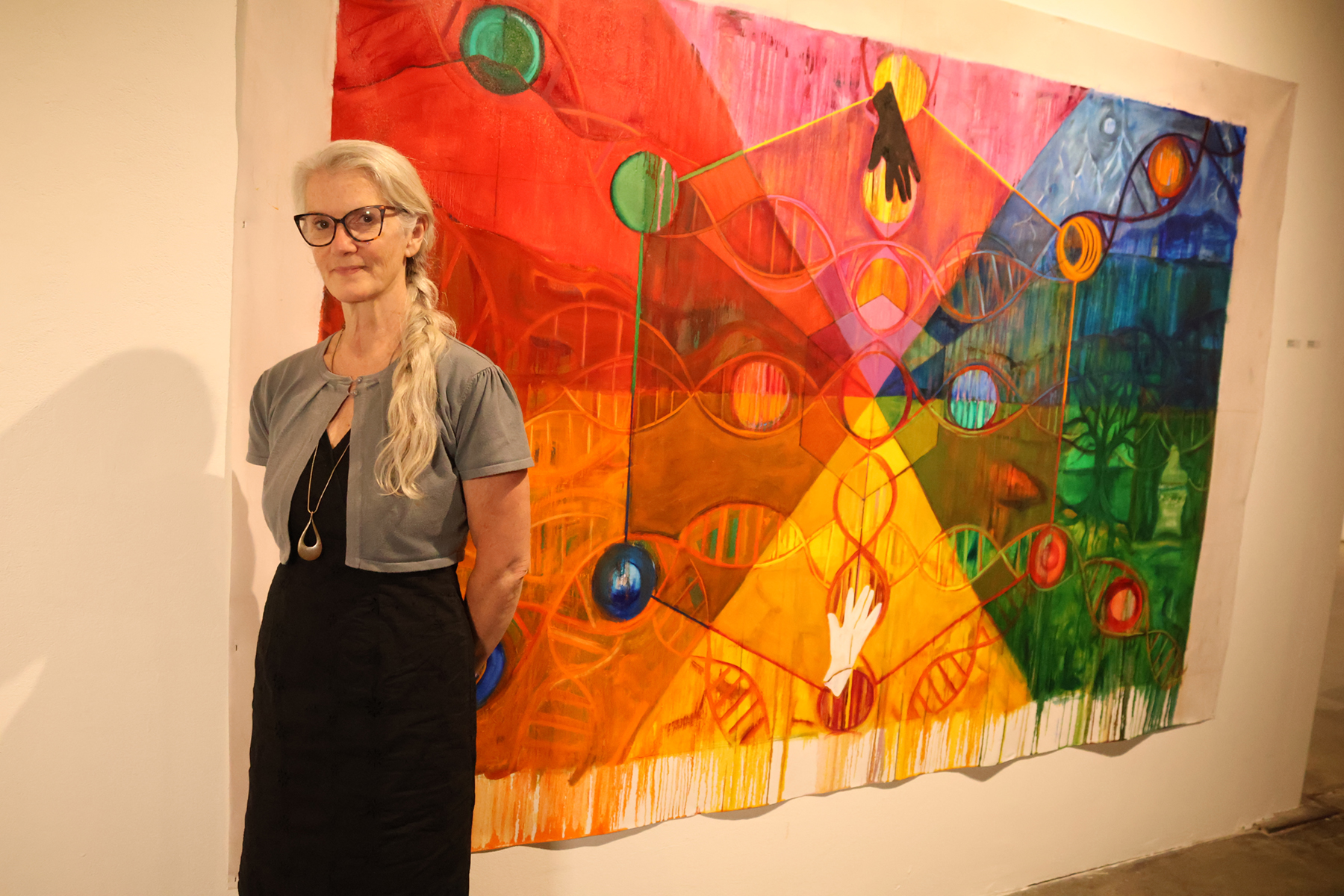 Borg posing beside artwork.