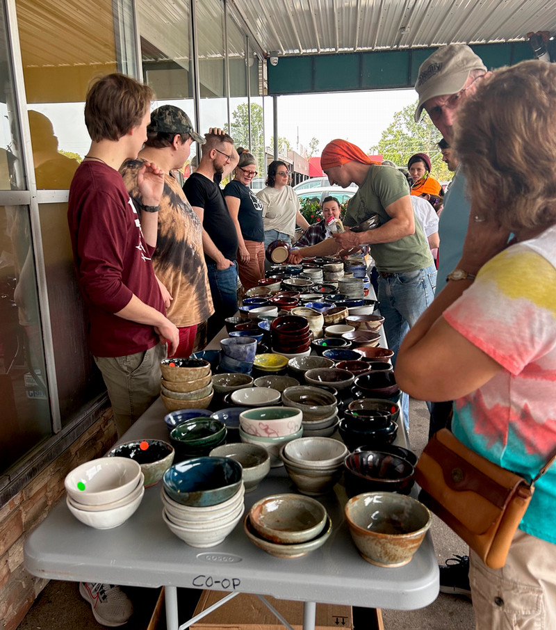 Shopper looking at bowls for sale.