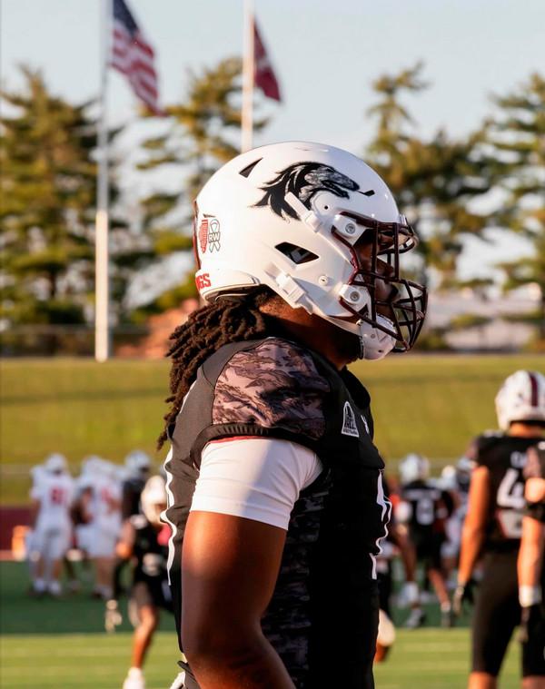 Vontrell in football uniform.