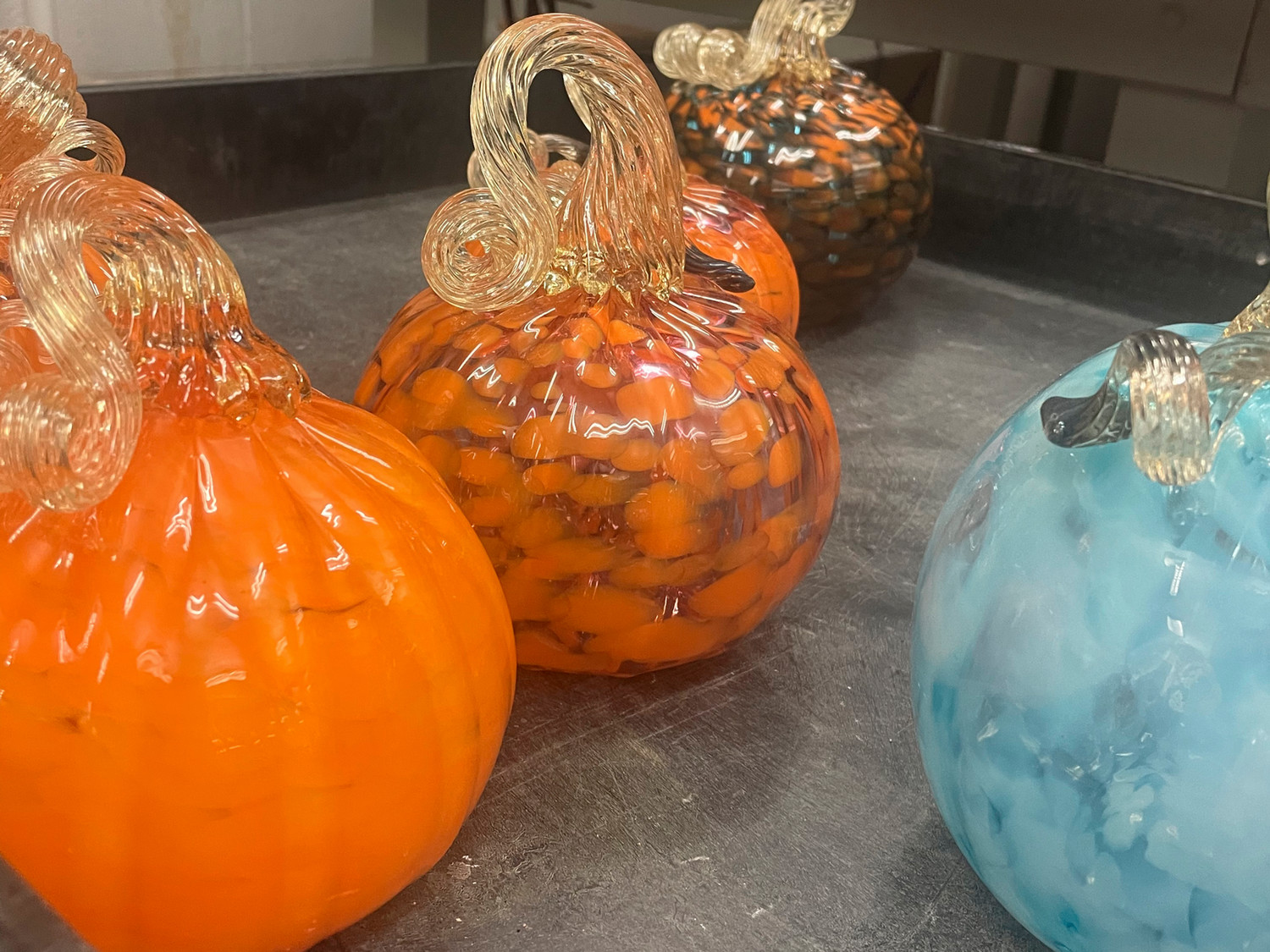 Four glass art pieces.