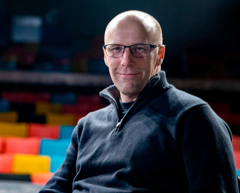 Matthew Williams poses inside theater space